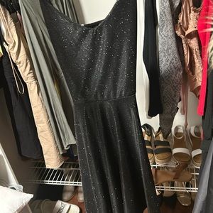 Black sparkly dress white cross in back